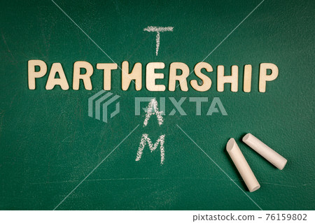 Partnership and Team concept. Letters of the alphabet on a green chalk board Partnership and Team concept. Letters of the alphabet on a green chalk board 76159802