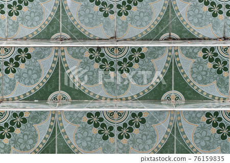 Stairs are paved with flower-patterned tiles. Stairs are paved with flower-patterned tiles. 76159835