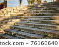Ancient stone stairs illuminated by the sun and with shadows 76160640
