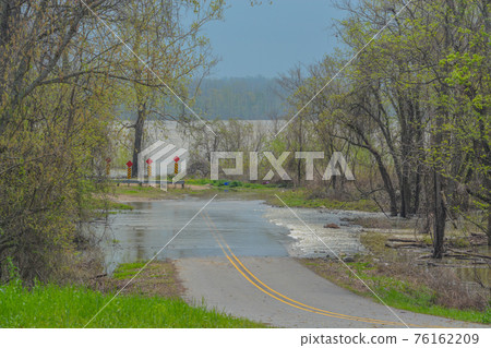 The Mississippi River is flooding over the roadway in St. Joseph, Tensas Parish, Louisiana The Mississippi River is flooding over the roadway in St. Joseph, Tensas Parish, Louisiana 76162209