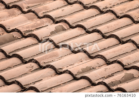 tiled roof of the house wavy light brown sloping background tiled roof of the house wavy light brown sloping background 76163410