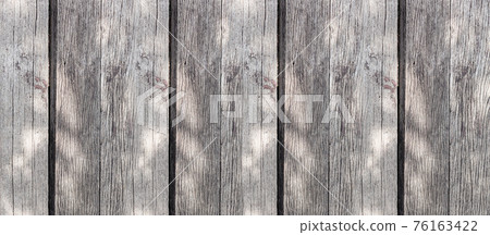 gray faded boards in sunlight vertical stripes background gray faded boards in sunlight vertical stripes background 76163422