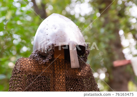 forged helmet of a medieval warrior and chain mail try rusty forged helmet of a medieval warrior and chain mail try rusty 76163475
