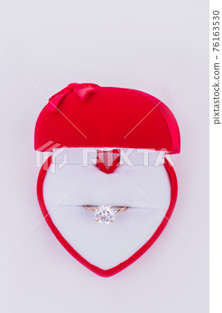 Red gift box with diamond ring. Red gift box with diamond ring. 76163530
