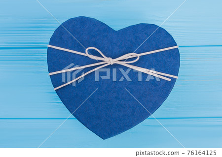 Blue heart shaped gift box. Blue heart shaped gift box. 76164125