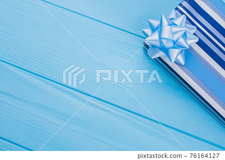 Gift box on wood and copyspace. Gift box on wood and copyspace. 76164127
