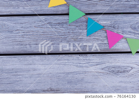 Triangle papers hanging on rope. Triangle papers hanging on rope. 76164130