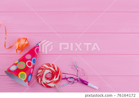 Party accessories on pink wooden background. 76164172