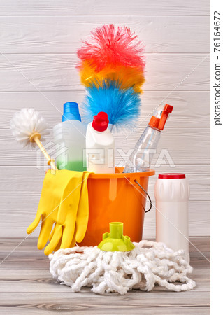 Variety of cleaning products in bucket. Variety of cleaning products in bucket. 76164672