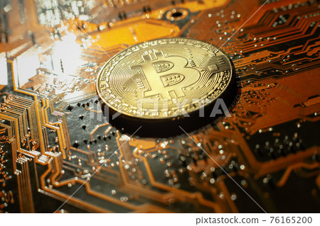 Electronic circuit blur. Bitcoin coin on electronic board Electronic circuit blur. Bitcoin coin on electronic board 76165200