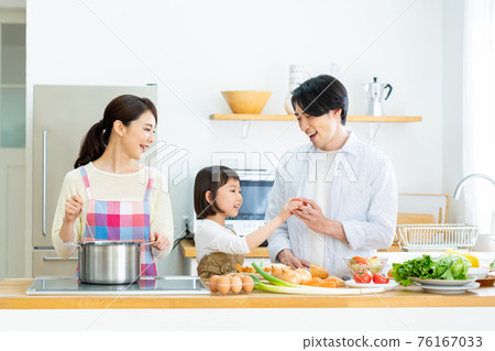 Young family cooking in the kitchen Young family cooking in the kitchen 76167033