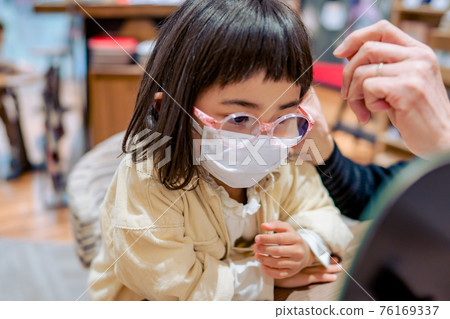 Girl wearing glasses debuts with glasses Girl wearing glasses debuts with glasses 76169337