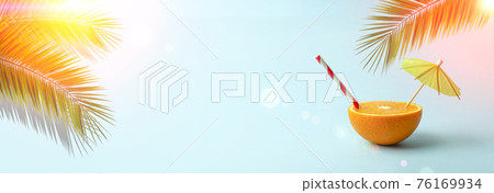 Palm leaves and orange background. Tropical palm leaves and juicy orange on a blank colored background. Summer, beach, tropics, sun, vacation concept 76169934