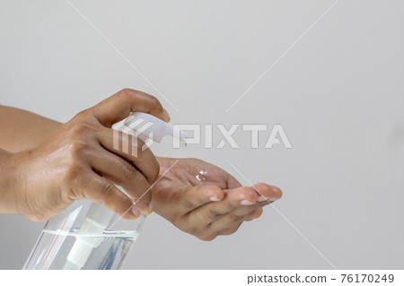 Women's hands are pressing the hand wash gel for Coronavirus or covid-19 prevention for the concept of health care and disease prevention. 76170249