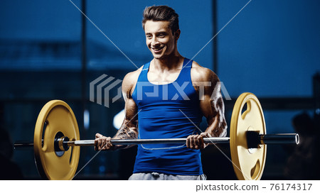 fit man training arm muscles at gym fit man training arm muscles at gym 76174317