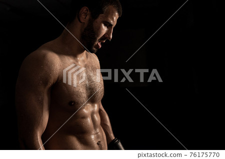 athlete after training. Young man at gym after her workout athlete after training. Young man at gym after her workout 76175770