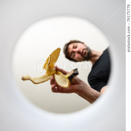 young man throws away organic trash young man throws away organic trash 76175776