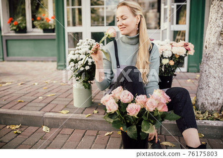 Floristry concept. bouquet of beautiful flowers. Spring colors. the work of the florist at a flower shop 76175803