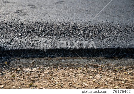 New asphalt tarmac texture road of repairing on the damaged highway 76176462