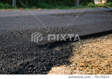 New asphalt tarmac texture road of repairing on the damaged highway 76176624