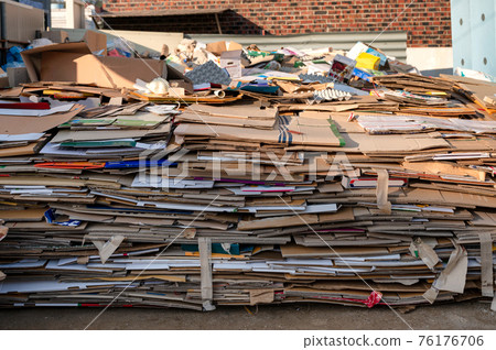 Pile of folded cardboard and paper box stored for recycle Pile of folded cardboard and paper box stored for recycle 76176706