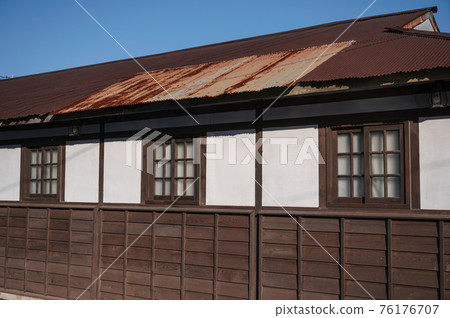 Traditional wooden old house with window and zinc roof 76176707