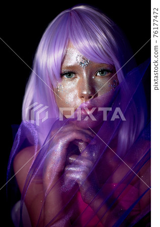 A girl with purple hair and glowing skin. An alien or a fairy with glowing skin. 76177472