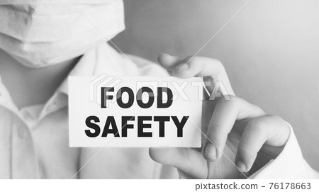Doctor holding a card with text Food Safety, medical concept Doctor holding a card with text Food Safety, medical concept 76178663