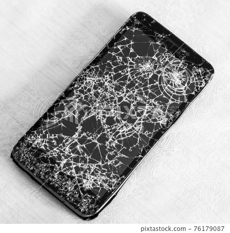 The Smartphone with the broken glass screen 76179087