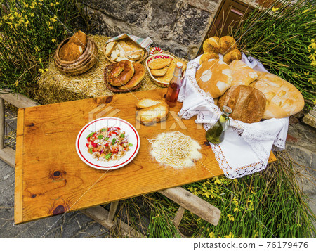 Rustic wooden board full of typical tuscan food, italian countryside 76179476