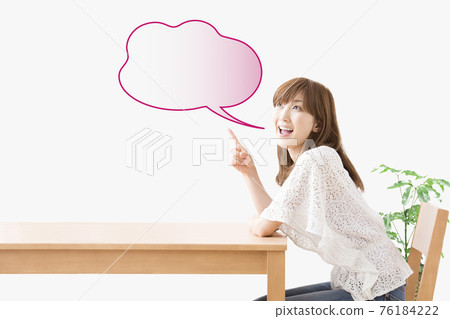 Woman sitting on chair 76184222