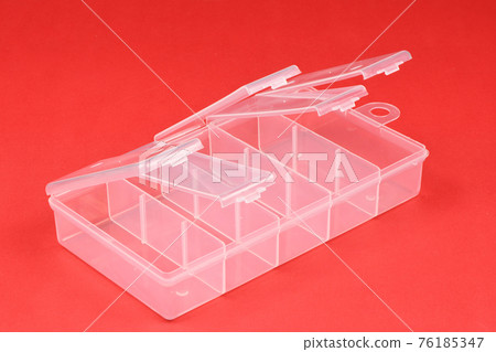 Food plastic box isolated on red. Food plastic box isolated on red. 76185347
