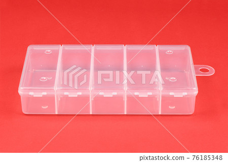 Food plastic box isolated on red. Food plastic box isolated on red. 76185348