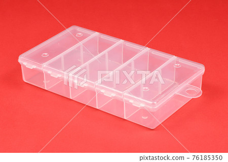 Food plastic box isolated on red. Food plastic box isolated on red. 76185350