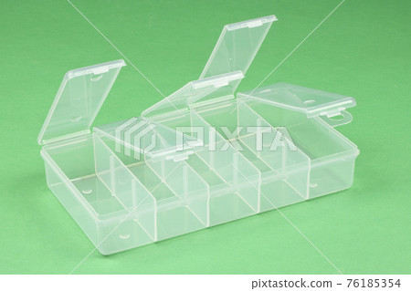 Food plastic box isolated on green. Food plastic box isolated on green. 76185354