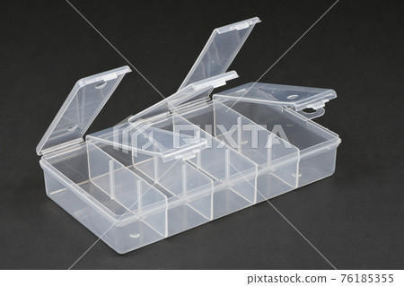 Food plastic box isolated on black. Food plastic box isolated on black. 76185355
