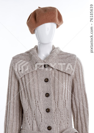 Brown beret and grey knitted sweater. Brown beret and grey knitted sweater. 76185639