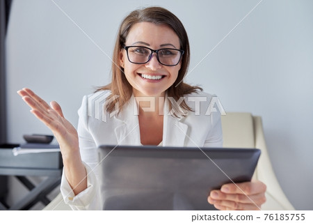 Woman teacher, mentor, psychologist looking at webcam, talking, counseling Woman teacher, mentor, psychologist looking at webcam, talking, counseling 76185755