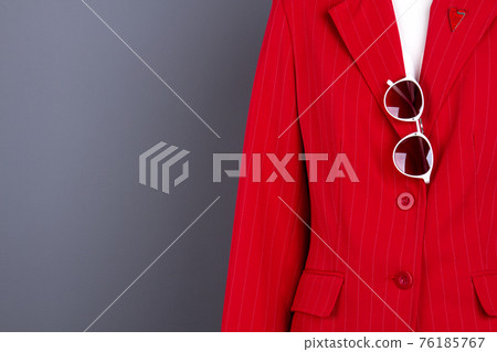Women elegant blazer, sunglasses and copy space. Women elegant blazer, sunglasses and copy space. 76185767