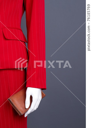 Red elegant clothes and brown wallet. Red elegant clothes and brown wallet. 76185769