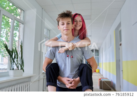 Students teenagers, couple happy laughing male and female having fun together 76185912