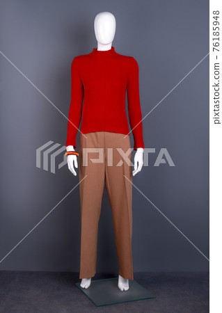 Female mannequin in red sweater and trousers. Female mannequin in red sweater and trousers. 76185948