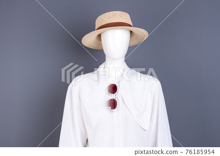 Hat, white blouse and sunglasses. Hat, white blouse and sunglasses. 76185954
