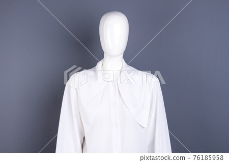 Mannequin in white female chiffon shirt. 76185958