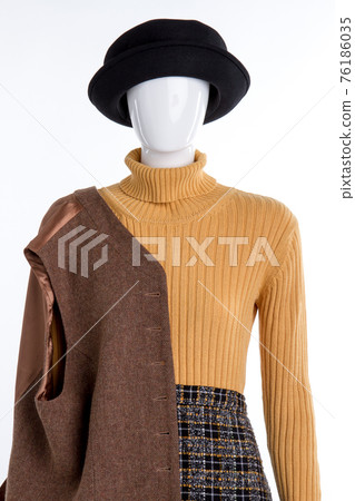 Stylish warm winter clothing on mannequin. Stylish warm winter clothing on mannequin. 76186035