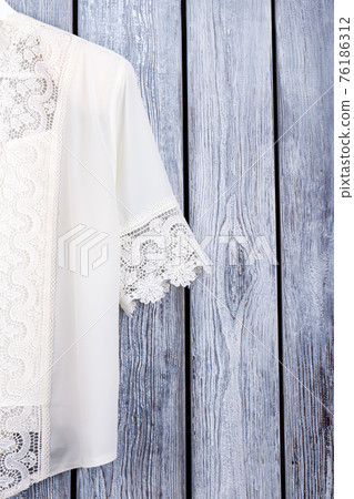 Cropped view white lace blouse. 76186312