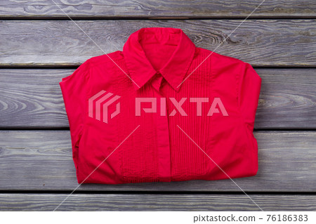 Red folded shirt. 76186383