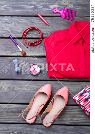 Various makeup products, shirt and shoes. Various makeup products, shirt and shoes. 76186384