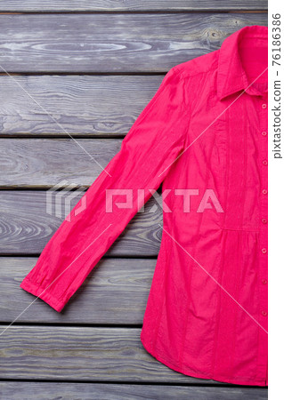 Pink shirt sleeve, flat lay. 76186386