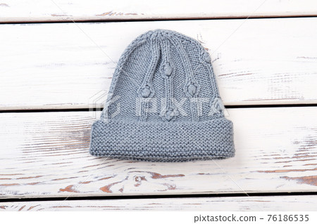 Grey knitted woolen hat. Grey knitted woolen hat. 76186535